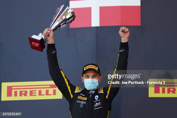 Race winner Christian Lundgaard of Denmark and ART Grand Prix celebrates on the podium during the Formula 2 Championship Sprint Race at Mugello...