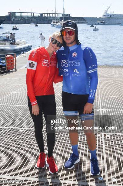 Princess Charlene of Monaco pose with Gareth Wittstock after the arrival of The crossing Monaco Water Bike Challenge on September 13, 2020 in Monaco.