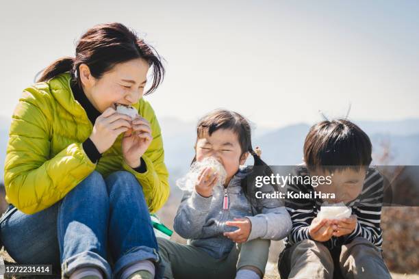 family hiking in the mountain - rice ball stock pictures, royalty-free photos & images