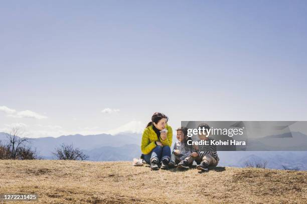 family hiking in the mountain - rice ball stock pictures, royalty-free photos & images