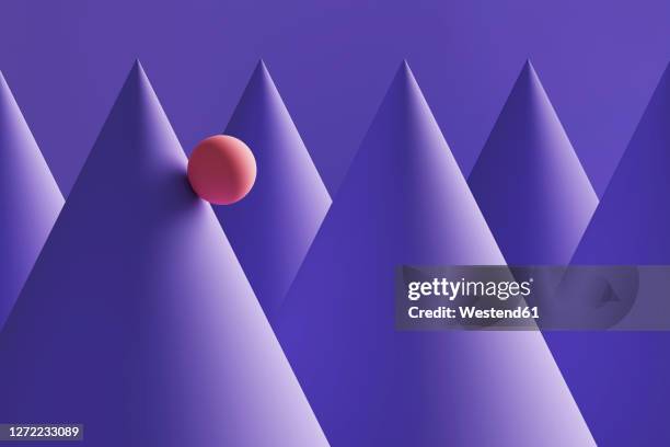 three dimensional render of orange sphere rolling down purple cones - rolling stock illustrations