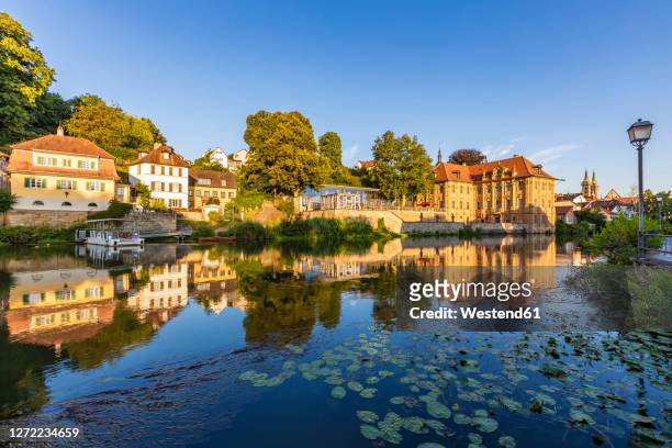 germany, bavaria, bamberg, villa concordia and surrounding houses reflecting in river regnitz - bamberg stock pictures, royalty-free photos & images