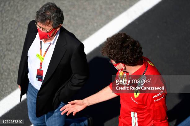Scuderia Ferrari Team Principal Mattia Binotto and Ferrari CEO Louis C Camilleri talk before the F1 Grand Prix of Tuscany at Mugello Circuit on...