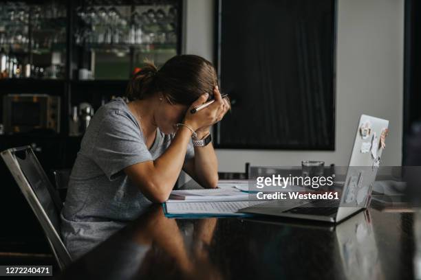 teenage girl studying from home, using laptop - emotional stress stock pictures, royalty-free photos & images