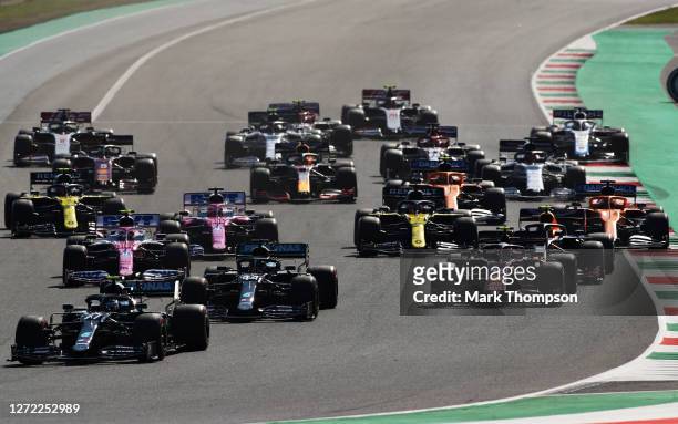 Valtteri Bottas of Finland driving the Mercedes AMG Petronas F1 Team Mercedes W11 leads the field into turn one at the start during the F1 Grand Prix...