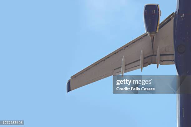 close-up shot of airplane wings - aeroplane close up stock pictures, royalty-free photos & images