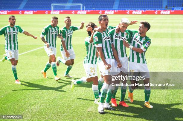 Cristian Tello of Real Betis celebrates with his team mates after scoring his team's first goal during the La Liga match between Alaves and Real...