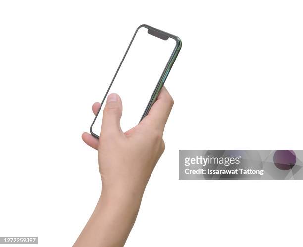 close up hand hold phone isolated on white, mock-up smartphone white color blank screen - mano umana foto e immagini stock