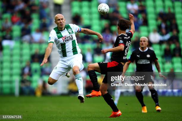 Arjen Robben of Football Club Groningen battles for the ball with Olivier Boscagli of PSV during the Dutch Eredivisie match between FC Groningen and...