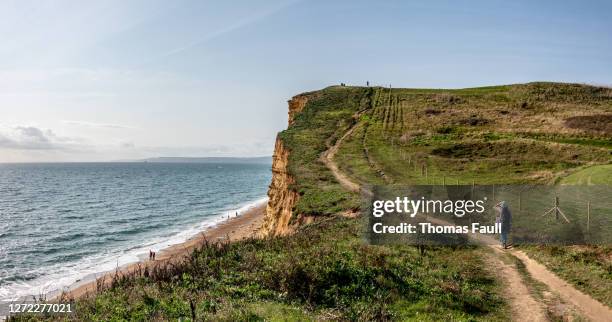 south west coast path at west bay cliffs in dorset - dorset uk stock pictures, royalty-free photos & images