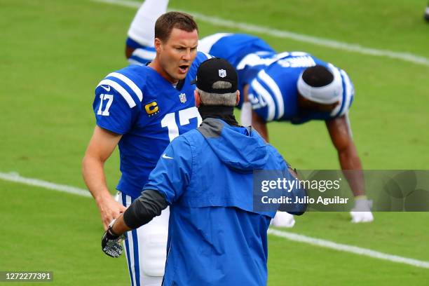 Philip Rivers and head coach Frank Reich of the Indianapolis Colts shake hands before a game against the Jacksonville Jaguars at TIAA Bank Field on...