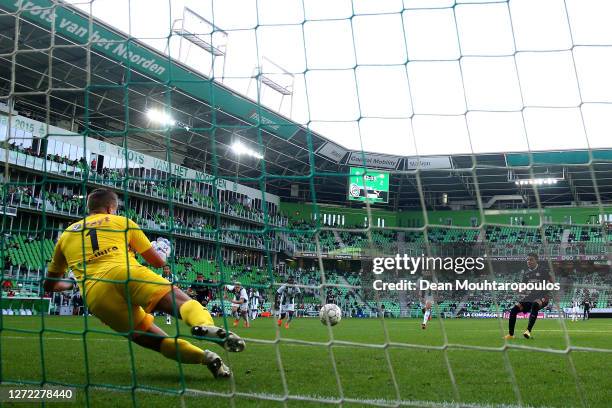 Donyell Malen of PSV takes and misses a penalty against Goalkeeper Sergio Padt of Football Club Groningen during the Dutch Eredivisie match between...