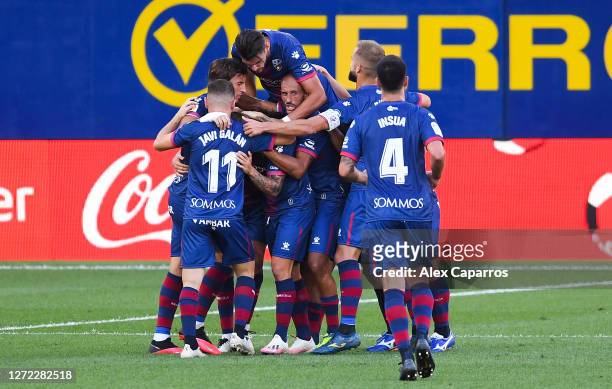 Pablo Maffeo of SD Huesca celebrates with his team mates after scoring his team's first goal during the La Liga match between Villarreal CF and SD...