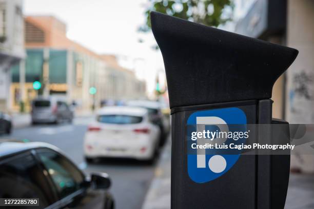 parking meter installed on the sidewalk of a street - parking meter stock pictures, royalty-free photos & images