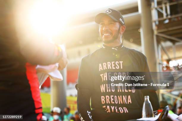 Race winner Lewis Hamilton of Great Britain and Mercedes GP wears a shirt in tribute to the late Breonna Taylor in parc ferme during the F1 Grand...
