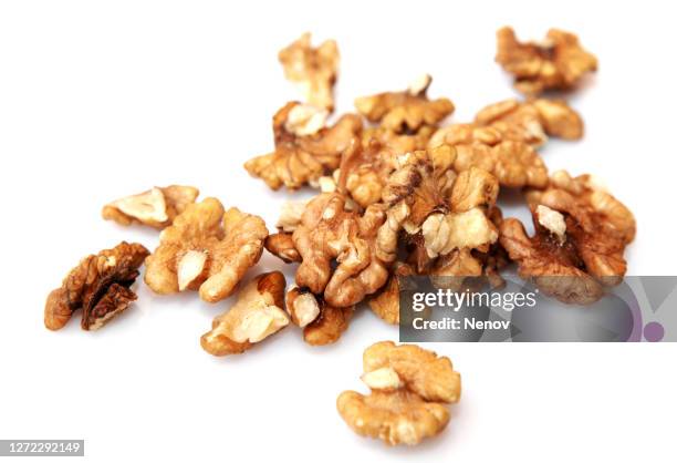 peeled walnuts isolated on white background - walnut fotografías e imágenes de stock