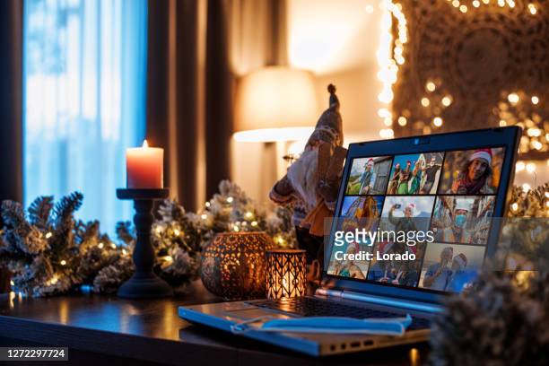 family calling on a home office set up for webinar and teleconference at christmas lockdown - quarantine stock pictures, royalty-free photos & images