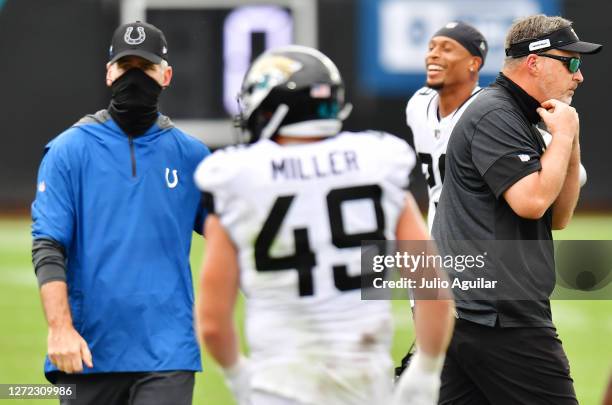 Head coach Frank Reich of the Indianapolis Colts and head coach Doug Marrone of the Jacksonville Jaguars walk toward their respective locker rooms...