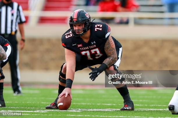 Center Dawson Deaton of the Texas Tech Red Raiders prepares to snap the ball during the first half of the college football game against the Houston...