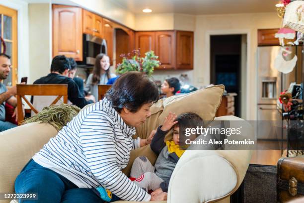 grandmother hugging her 3-years-old grandson. - celebrating 15 years stock pictures, royalty-free photos & images