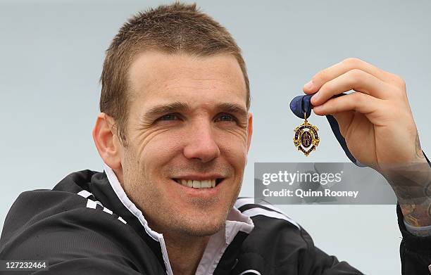 Dane Swan of the Magpies poses with the Brownlow Medal during a Collingwood Magpies AFL recovery session at St Kilda Sea Baths on September 27, 2011...