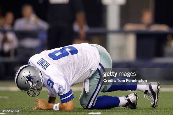 Tony Romo Stab Tony Romo of the Dallas Cowboys gets up after being hit during their ...