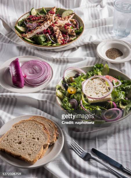 feta cheese salad and grilled chicken breast  salad with vegetables and pomegranate (click for more) - greek salad stock pictures, royalty-free photos & images