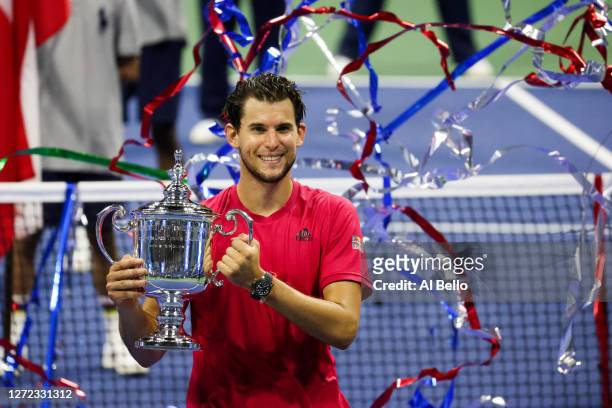Dominic Thiem of Austria celebrates with the championship trophy after winning in a tie-breaker during his Men's Singles final match against...