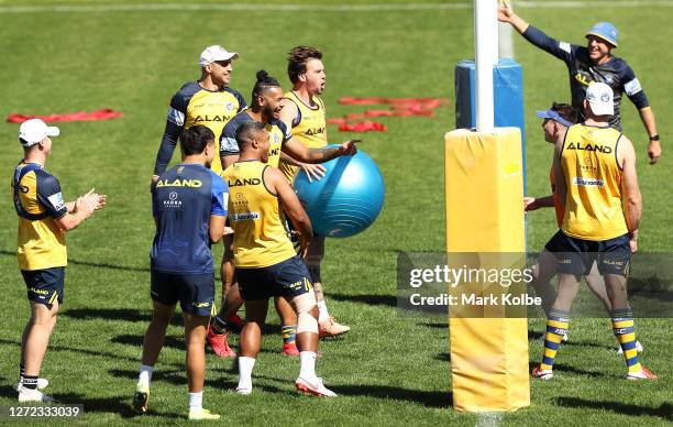 Blake Ferguson, Waqa Blake, Clinton Gutherson and Michael Jennings celebrate a poin tin a game of volleyball during a Parramatta Eels NRL training...