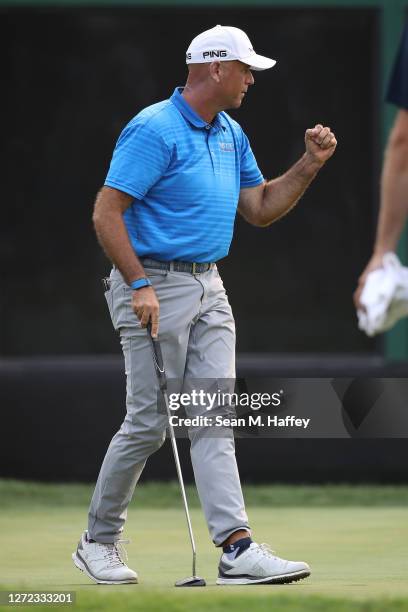 Stewart Cink celebrates after his birdie putt on the 18th hole to finish -21 in the final round of the Safeway Open at Silverado Resort on September...