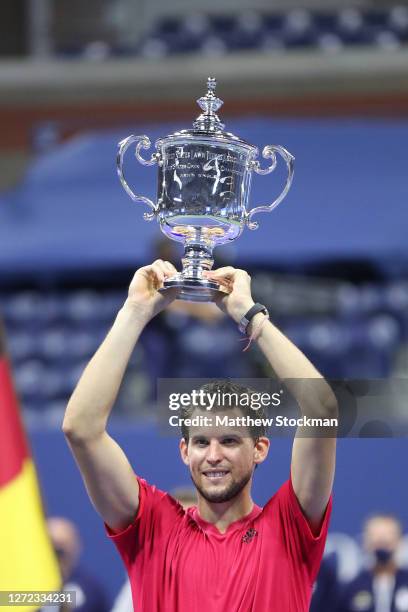 Dominic Thiem of Austria celebrates with championship trophy after winning in a tie-breaker during his Men's Singles final match against Alexander...