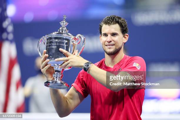 Dominic Thiem of Austria celebrates with championship trophy after winning in a tie-breaker during his Men's Singles final match against Alexander...