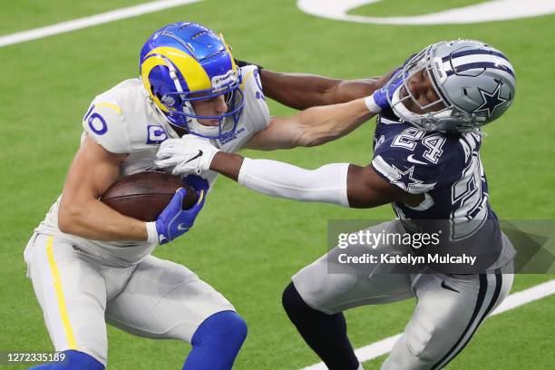 Cooper Kupp of the Los Angeles Rams stiff arms Chidobe Awuzie of the Dallas Cowboys during the second quarter at SoFi Stadium on September 13, 2020...