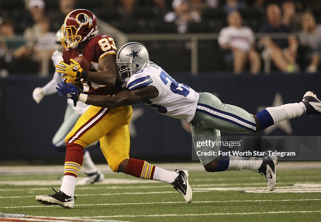 Cowboys Redskins Rivalry Washington Redskins tight end Fred Davis is tackled by Dallas Cowboys ...