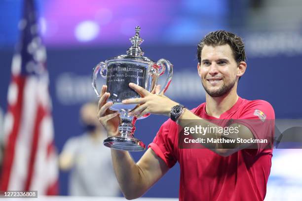Dominic Thiem of Austria celebrates with championship trophy after winning in a tie-breaker during his Men's Singles final match against Alexander...
