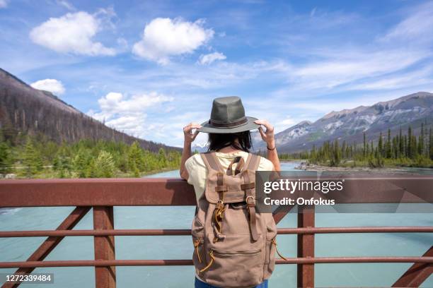 young woman at vermilion river in kootenay national park, british columbia, canada - sustainable tourism stock pictures, royalty-free photos & images