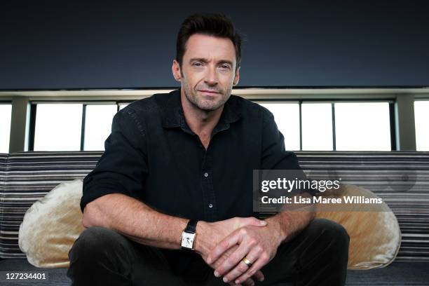 Australian actor Hugh Jackman poses during a photo call to promote his new film Real Steel at the Intercontinental Hotel on September 27, 2011 in...