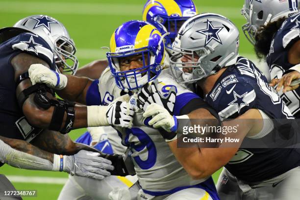 Aaron Donald of the Los Angeles Rams rushes against Connor Williams and the Dallas Cowboys offensive line during the second half at SoFi Stadium on...
