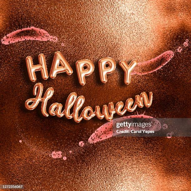 happy halloween text in orange foil ballon and sparky background - halloween font stock pictures, royalty-free photos & images