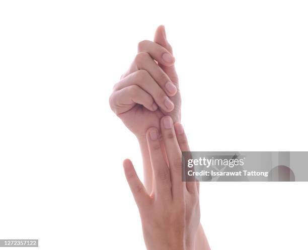 woman applying hand cream, closeup - fingernägel lackieren stock-fotos und bilder