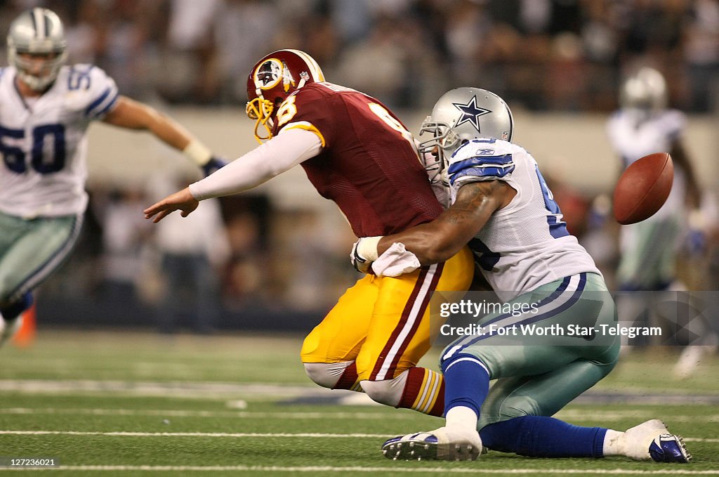 Cowboys Redskins Rivalry Dallas Cowboys outside linebacker Anthony Spencer strips the ball ...