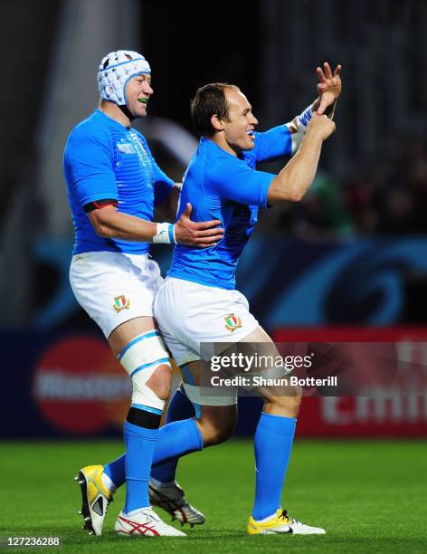 Sergio Parisse of Italy celebrates with teammate Cornelius van Zyl after he scores their first try during the IRB 2011 Rugby World Cup Pool C match...