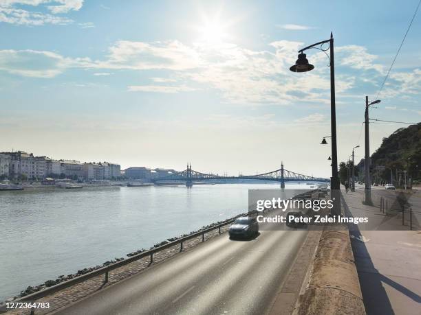 danube river in budapest, with the liberty bridge in the background - quayside stock pictures, royalty-free photos & images