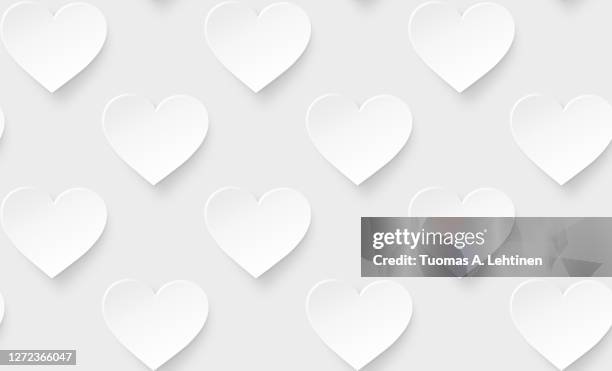 many white hearts on a light gray background. - valentines background stock pictures, royalty-free photos & images