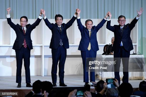 Former Foreign Minister Fumio Kishida, Japan's Prime Minister Shinzo Abe, Chief Cabinet Secretary Yoshihide Suga, and former Defense Minister Shigeru...