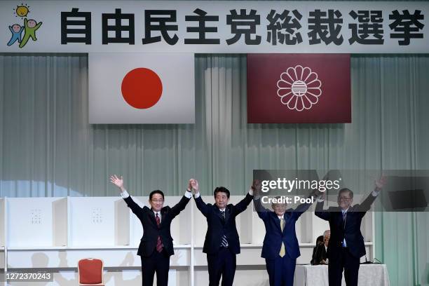 Former Foreign Minister Fumio Kishida, Japan's Prime Minister Shinzo Abe, Chief Cabinet Secretary Yoshihide Suga, and former Defense Minister Shigeru...