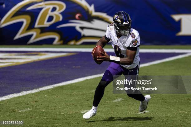 Lamar Jackson of the Baltimore Ravens scrambles against the Cleveland Browns during the first half at M&T Bank Stadium on September 13, 2020 in...
