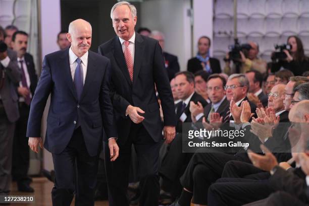 Greek Prime Minister George Papandreou attends a convention of the Federation of German Industry , where he spoke in an appeal for more German...