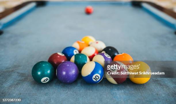 close-up of multi colored balls on table - snookerkugel stock-fotos und bilder