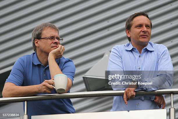 Member of the board Peter Peters and manager Horst Heldt attend the FC Schalke training session at the training ground at Veltins Arena on September...